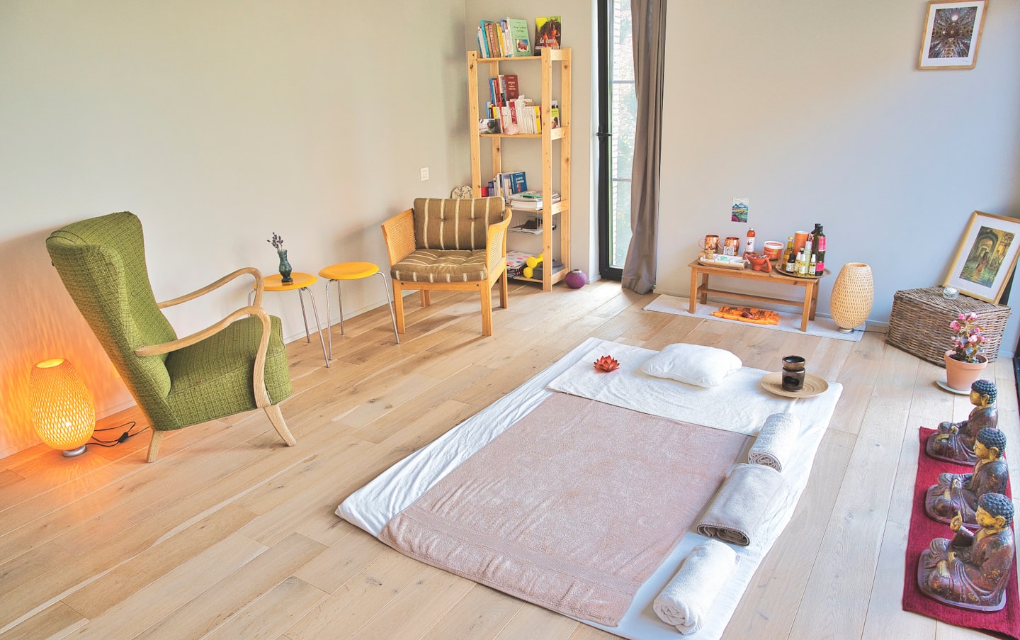 Wellness room with a floor mattress and various relaxation equipment.